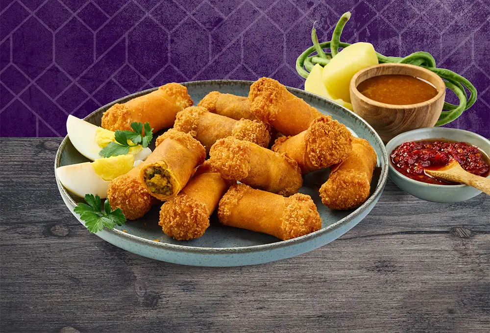 Diese köstlich würzigen Mini-Röllchen sind gefüllt mit zartem Hähnchen, knackigem Gemüse und aromatischen Garam-Masala-Gewürzen.